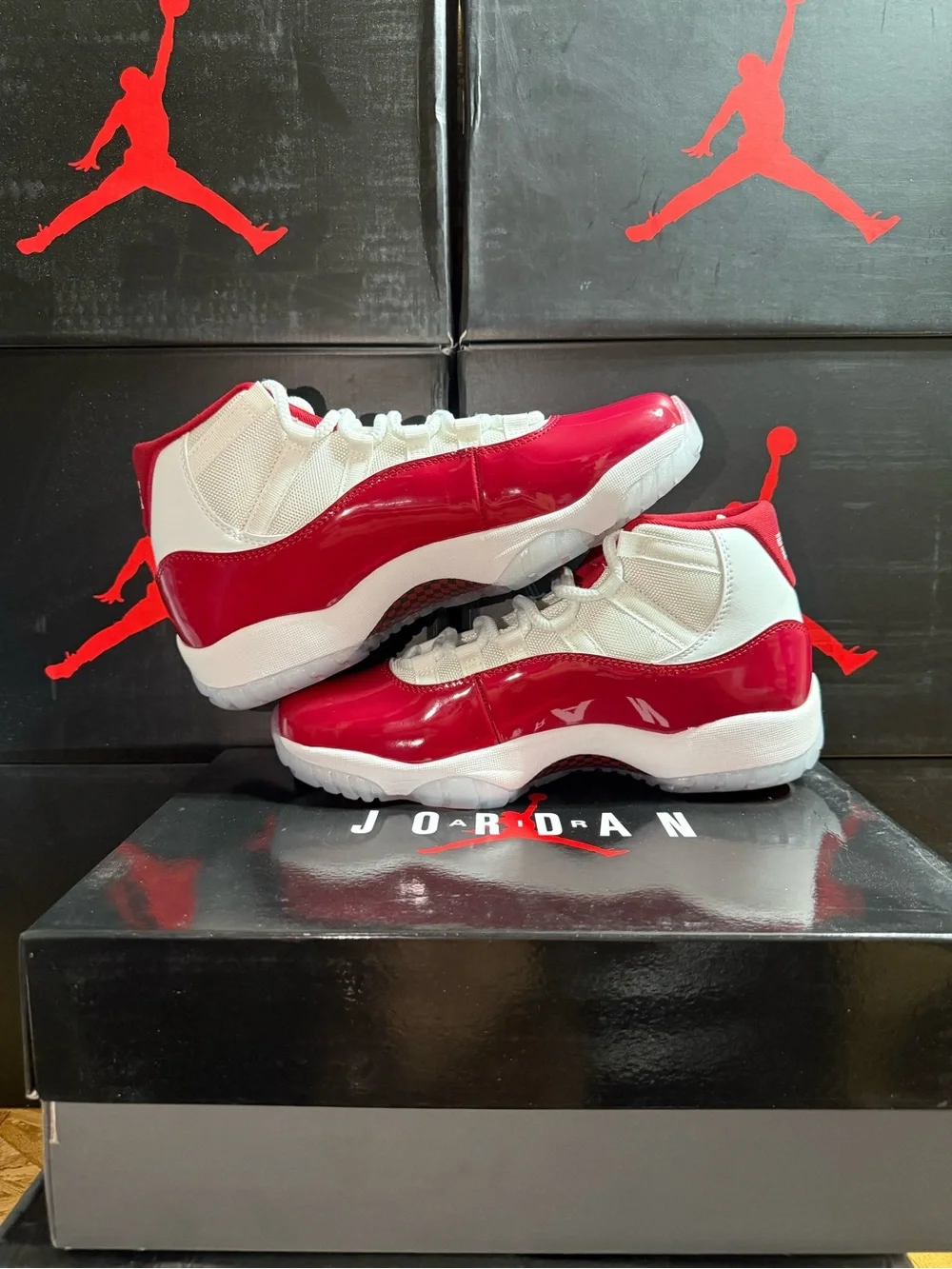 Air Jordan 11 Retro Cherry Top Sneakers in White and Red